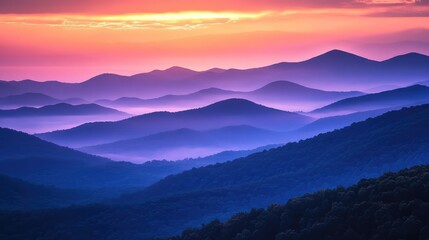 Fototapeta premium Sunset over the Blue Ridge Mountains, with layers of mist and warm hues filling the sky