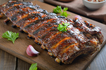 Spicy hot grilled spare ribs on cutting board