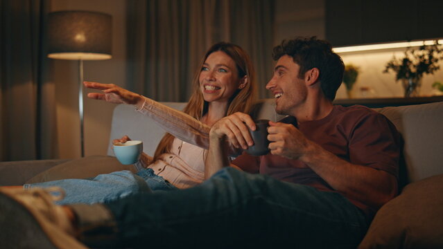 Excited family watch comedy movie have good time evening room together closeup