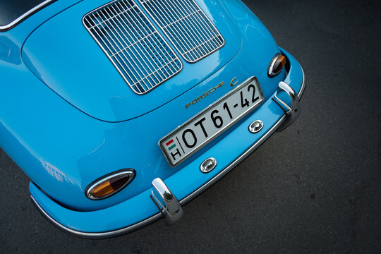 Close-up engine hood with twin grilles, rear lights and nameplate Porsche C. Late model Porsche 356 from 1964. Subotica, 29.06.2024