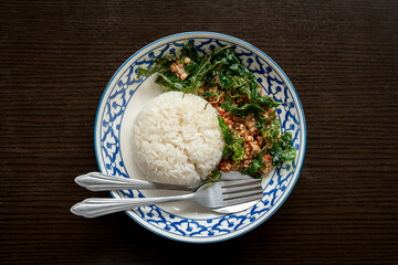 Stir-fried rice with minced pork and basil and fried egg. Crispy basil. Thai food. Steed Food Thailand...