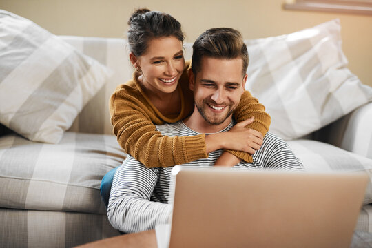 Laptop, digital and online with couple in living room for investment portfolio, application and bank loan. Future, technology and partnership with man and woman in home for real estate research - Powered by Adobe