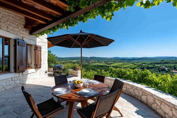 Country house with a stone patio, shaded by grapevines perfect for outdoor dinners under the warm evening sky