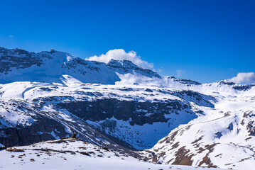 Snow cladded mountain view enroute Rupin pass trekking trail. It is a high altitude trek in Himachal Pradesh located at 4650m with Himalayan ranges, glacial meadows and snow-covered landscapes.