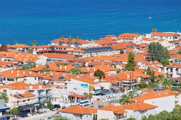 Obraz premium View of pefkochori town, greece with part sea view from hill