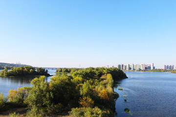 Fototapeta premium landscape with the Dnipro river in the city of Kyiv and the blue sky