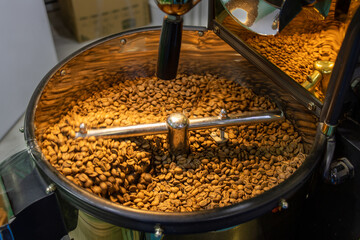 Coffee beans are roasted in the roasting machine. Coffee grinding and roasting