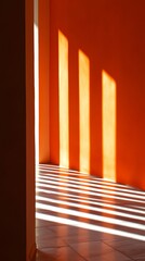 Fototapeta premium Sunlight casting long shadows on orange wall