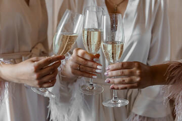 Elegant Celebration with Champagne Toast in Luxurious Satin Robes