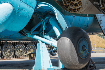 Aircraft brake repair. Close up of airplane wheel and shaft. Huge airplane tyre with shaft and...