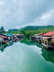 Naklejka premium Traditional Fishermen’s Houses on Stilts in a Small Village on Koh Rong, Cambodia