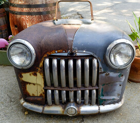 front view of antique weathered auto