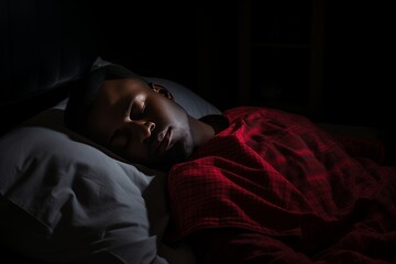 Black man in bed suffering from insomnia and sleep disorder 