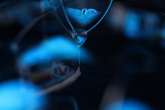 Blue reflections of liquid in macro, black and silver colors, rainbow, Black and silver bubbles in macro, connection of bubbles in macro, cell from liquid, molecules connection, fluid art