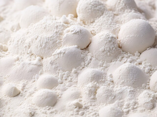 Cooking bread and buns, flour covered dough shapes on wooden cutting board in the kitchen