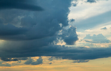 cumulonimbus clouds and nimbostratus clouds in the evening sky