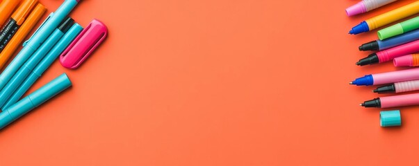 Overhead view of a desk with colorful pens and markers, creative tools, vibrant office supplies