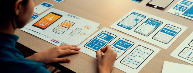 Panorama banner of startup company employee planning on user interface prototype for mobile...