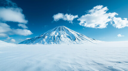 A dormant volcano rests amidst the snow, its slopes covered in a white blanket that contrasts with the dark rocks. The icy landscape surrounds the silent crater.