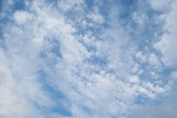 gentle white clouds in the blue sky