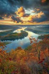 Obraz premium Autumn sunset over winding river with vibrant foliage in the foreground
