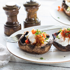 Portabello mushroom eggs Benedict on a plate, ready for eating.