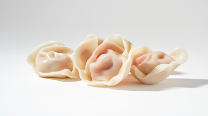 tortellini with prosciutto and cream sauce with a light dusting of nutmeg against an isolated white background