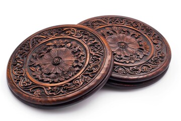 Fototapeta premium A pair of wooden coasters placed on a table, ideal for holding drinks or serving as decorative accents