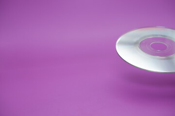 a compact disc isolated on purple background