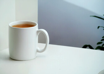 3D Render of a white mug filled with coffee on a white surface.