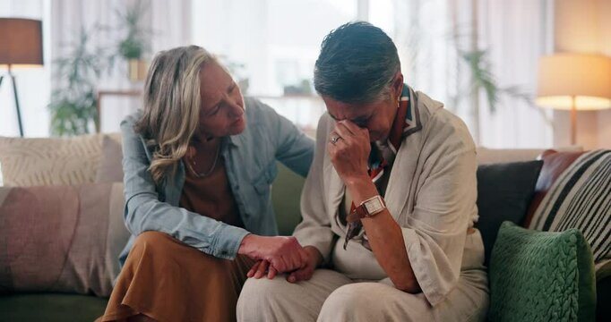 Senior couple, women and crying for support, comfort and relationship in living room with love or care. Elderly people, embrace and sad in house for LGBTQ, empathy and gay partner with helping hands