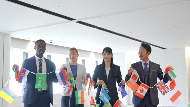 A group of multinational business people holding flags of all nations