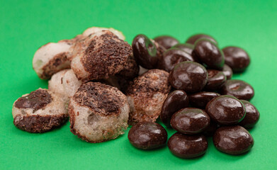 Crisp Freeze Dried Chocolate Covered Cream Filled Mint Candy on a Green Background