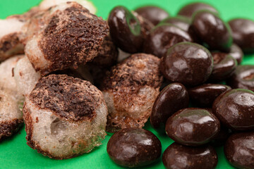 Crisp Freeze Dried Chocolate Covered Cream Filled Mint Candy on a Green Background