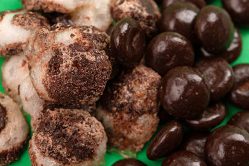 Crisp Freeze Dried Chocolate Covered Cream Filled Mint Candy on a Green Background