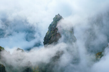 A mountain covered in fog and clouds. Near Pico de Arieiro , Madeira island, Portugal