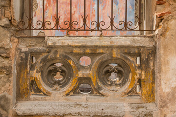 Cuba, Havana. Regla district. Colorful windows. Peeling paint.Wrought iron grills on window. 2016-04-03