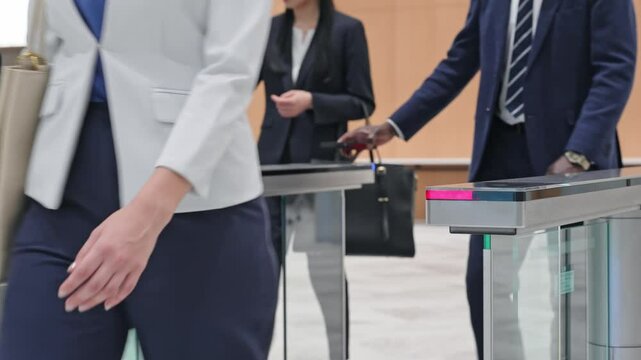 Group of multinational business people passing through a security gate