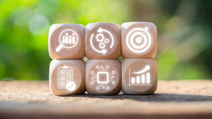 Wooden blocks with digital automation and business optimization icons, symbolizing efficiency,...