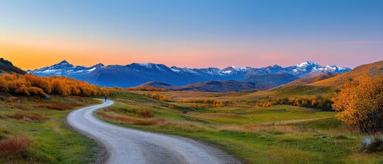 Fototapeta premium Winding Mountain Road Amidst Lush Green Trees at Dawn or Dusk.