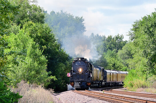 The largest steam locomotive ever built, a Union Pacific Railroad 'Big Boy' on the move after crossing the Mississippi River into Illinois during its 2024 Big Boy American Heartland Tour.