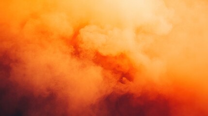 A vibrant display of orange and yellow smoke, creating an abstract and atmospheric effect.