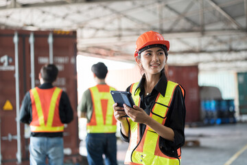 Asian warehouse woman worker working in warehouse. Asian woman worker inspecting quality of product in storage warehouse