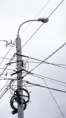 A pole with wires and a light on top