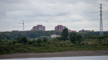 Obraz premium A rural area with a few buildings and a power line