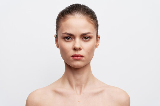 portrait, beauty, model, close up, neutral expression, studio shot, young woman with straight hair, clean background, natural lighting, minimalism