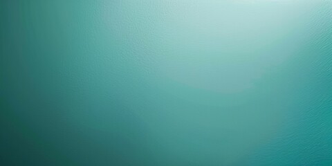 Obraz premium a minimalist background using a soft teal color. The background should be plain and smooth, perfect for creating a clean and modern atmosphere