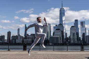 Sport running morning exercise. Man runner training in Manhattan. Sport athlete man running in New York city. Sport routine. Athlete man running outdoor. Functional fitness