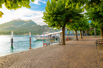 View from the waterfront promenade and tree lined park and ferry station at the town of Bellagio,...
