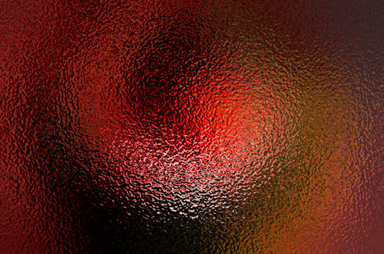 Dark  red glass foil light design on red rough blur background with red filter effect. Glass effect background 